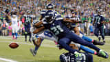 Kam Chancellor of the Seattle Seahawks forces Calvin Johnson of the Detroit Lions to fumble near the goal line during their game at CenturyLink Field on Oct. 5, 2015, in Seattle.