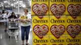 Customers shop near a display of General Mills Cheerios cereal at a Costco Wholesale store in Louisville, Kentucky.