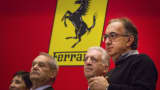 Sergio Marchionne, chief executive officer of Fiat Chrysler Automobiles NV (FCA), right, and Piero Ferrari, vice chairman of Ferrari SpA, second right, look on after ringing the opening bell of the New York Stock Exchange (NYSE) in New York, U.S., on Wednesday, Oct. 21, 2015