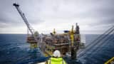 A visitor looks out towards a flare stack on the Oseberg A offshore gas platform operated by Statoil ASA in the North Sea 140kms from Bergen, Norway.