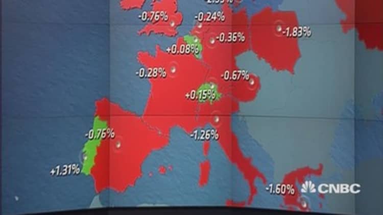 Europe ends lower as earnings dominate