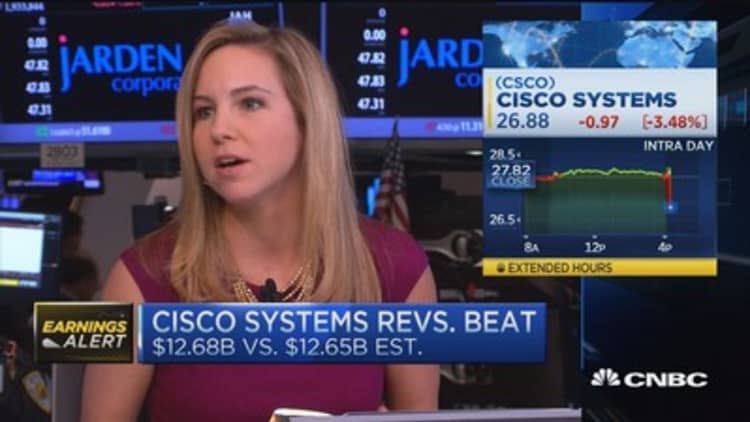Cisco beats earnings estimates, but shares fall