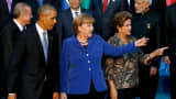 President Barack Obama (L-R) departs with Germany's Chancellor Angela Merkel and Brazil's President Dilma Rousseff after participating in a family photo with fellow world leaders at the start of the G20 summit at the Regnum Carya Resort in Antalya, Turkey, November 15, 2015.