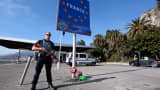 A French police officer stands guard at the Franco-Italian border in Menton, France, on Nov. 15, 2015, after the deadly attacks in Paris on Friday.