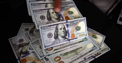 Dollar slides from 3-month high on weak details of U.S. jobs report