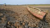 A wooden boat is stranded on the riverbed of the Dawuhan Dam during drought season in Madiun, Indonesia's East Java province, on Oct. 5, 2015.