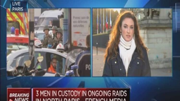 Three men in custody after Paris raid