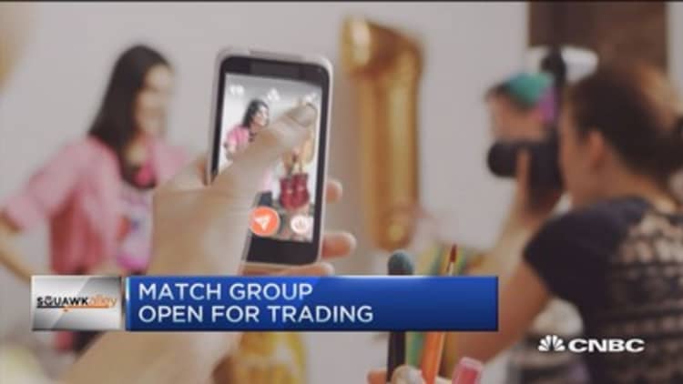 Tinder parent Match Group opens at $13.50 a share