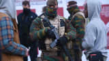 Soldiers patrol as the Belgian capital remains on the highest possible alert level.