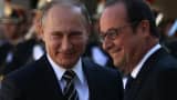 Russian President Vladimir Putin (L) is greeted by French President Francois Hollande (R) prior to their meeting at the Elysee Presidential Palace on October 2, 2015 in Paris, France.