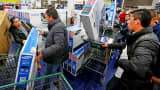 Shoppers purchase electronics and other items at a Best Buy in San Diego, California.