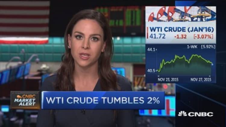 Crude tumbles on stronger dollar