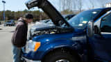 A customer looks at a Ford F-150 pickup truck in Brandywine, Maryland.
