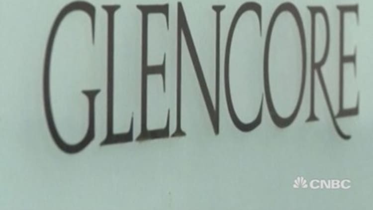 Glencore ups debt reduction