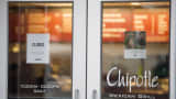 A sign showing that the Chipotle Mexican Grill seen at 1924 Beacon St. is closed on December 8, 2015 in Boston, Massachusetts.
