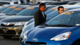 People look at vehicles at the AutoNation Toyota dealership in Cerritos, California.