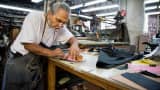 Roy Campos, owner of Justin Paul, works on a handbag at the company's manufacturing facility in Brooklyn, New York.