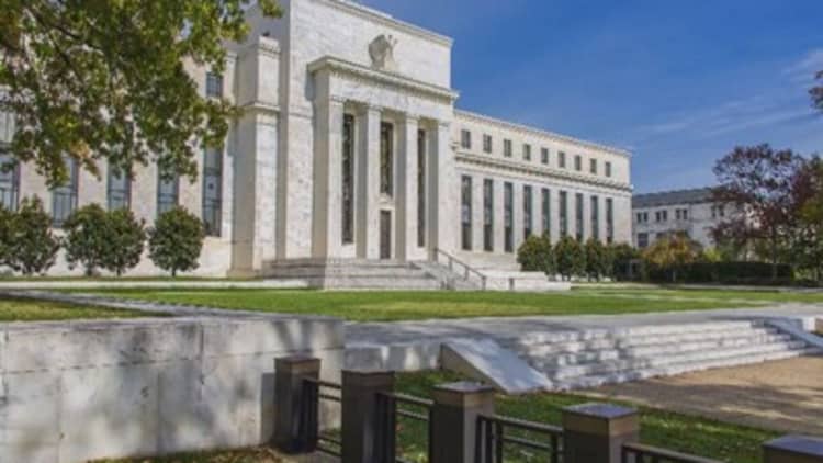 Fed raises rates