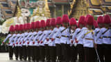 Royal Guards parade in front of the Grand Palace in Bangkok