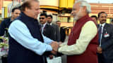 Prime Minister of Pakistan Nawaz Sharif (L) shakes hands with Indian Prime Minister Narendra Modi (R) at Allama Iqbal International Airport in Lahore, Pakistan on December 25, 2015.
