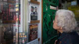 An elderly lady looks into a shop display of the Causeway Bay Books store in Hong Kong.