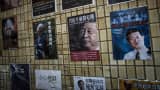 Posters of books about China's politics including some featuring Chinese President Xi Jinping are seen displayed in the staircase leading to a bookshop in Hong Kong.