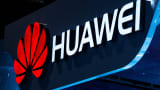 A logo sits illuminated outside the Huawei pavilion during Mobile World Congress 2015 in Barcelona, Spain.