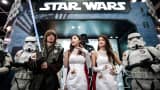 Performers dressed as Star Wars characters are seen at a booth of the 16th Ani-Com and Games exhibition in Hong Kong on July 25, 2014.