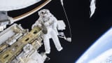 Expedition 46 Flight Engineer Tim Kopra performs a spacewalk outside the International Space Station in this December 21, 2015 NASA handout photo.