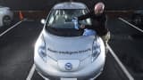 Ryan Dapello cleans a Nissan Leaf with piloted parking before a media preview of autonomous Renault-Nissan Alliance vehicles in Sunnyvale, California January 7, 2016.