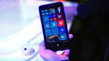 A visitor holds a new Windows Lumia 640 XL smartphone in the Microsoft Corp. pavilion at the Mobile World Congress in Barcelona, Spain, on Monday, March 2, 2015.