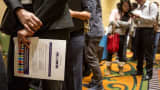 Job seekers wait in line to speak with recruiters during the San Jose Career Fair in San Jose, California.