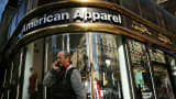 The American Apparel logo is displayed outside of a store in New York City.