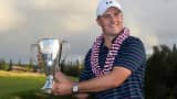 Jordan Spieth poses with the winner's trophy at the Hyundai Tournament of Champions on January 10, 2016 in Kapalua, Maui, Hawaii.