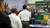 A Lockheed Martin talent acquisition manager greets job applicants at a U.S. Chamber of Commerce Foundation "Hiring Our Heroes" military job fair in Washington January 8, 2016.