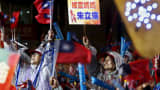 People show their support for the ruling Nationalist Kuomintang Party (KMT) chairman Eric Chu during a campaign rally a day before the election in New Taipei City, Taiwan January 15, 2016.