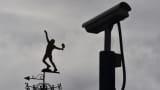 A CCTV camera is seen near a tennis player-shaped weather vane at the All England Lawn Tennis Club, where the Wimbledon Tennis Championships take place, in south London, Britain January 18, 2016. World tennis was rocked on Monday by allegations that the game's authorities have failed to deal with widespread match-fixing.