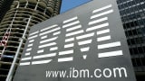 An IBM sign stands outside an IBM building in downtown Chicago, Illinois.