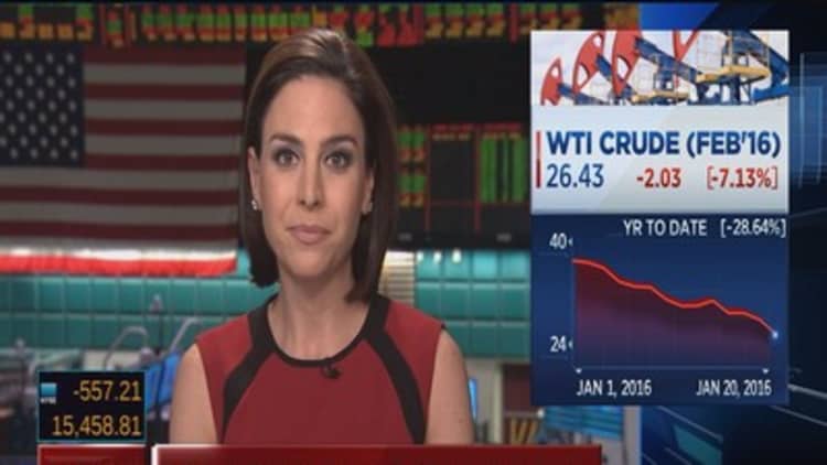 Oil tanks 7% to hit 12-year lows 