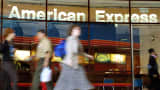 People walk in front of the American Express offices in New York City.