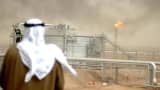 An employee of the Kuwait Oil Company (KOC) looks at 25 January 2005 the Gathering Center No.15 of al-Rawdatain field, 100 kms north of Kuwait City.