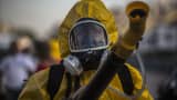 A worker fumigates the Sambadrome ahead of Carnival celebrations in Rio de Janiero, Brazil, on Tuesday, Jan. 26, 2016. The operation is part of the Health Ministry's efforts to eradicate the Aedes aegypti mosquito, which is thought to spread the Zika virus being blamed for causing birth defects.