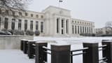 The US Federal Reserve is seen during a snow storm in Washington, DC.
