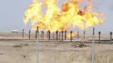 Excess gas is burnt off at a pipeline at Rumaila oilfield in Basra, Iraq January 26, 2016.
