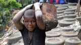 A child works in a forge in Abidjan, Ivory Coast.