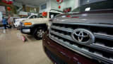 A logo of Toyota is seen in a Tundra truck.