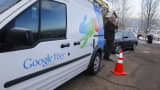 A technician gets cabling out of his truck to install Google Fiber.