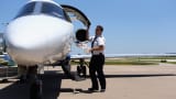 FlexJet First Officer Rob Caster conducts a post-flight inspection of a Learjet 45 aircraft after landing