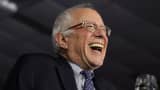 Democratic presidential candidate Sen. Bernie Sanders (I-VT) laughs as he speaks to supporters during a caucus night party February 1, 2016 in Des Moines, Iowa.