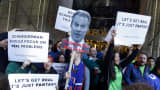 In this Nov. 13, 2015, file photo, fantasy sports fans demonstrate outside the Financial District offices of New York state Attorney General Eric Schneiderman, in New York.